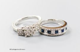 A modern 9ct white gold and triple diamond cluster set dress ring, size I/J and a similar sapphire