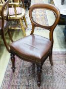 A set of six Victorian mahogany balloon-back dining chairs