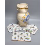 A pair of Delft wall brackets, a set of six delft small tiles and a large maiolica pitcher, height