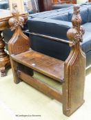 A pair of 15th century oak pew ends with stylised leaf and berry fleur-de-lys finials, joined by a
