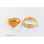 A late Victorian 18ct gold wedding band, size Q and a similar heart shaped signet ring, size M/N,