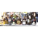 A group of assorted spirits and liqueurs including whisky;Cardhu, Columba cream, Lambs Navy rum,