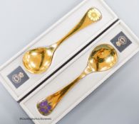 Two boxed Georg Jensen gilt sterling and enamel year spoons, 1973 & 1974 (Corn Marigold and Corn