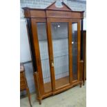 A Biedermeier style ebony inlaid mahogany breakfront display cabinet, W.120cm D.47cm H.197cm