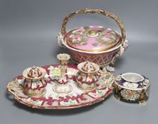 A 19th century English porcelain inkstand, a basket and associated cover and a Spode base, tallest