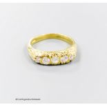 A modern Victorian style 18ct gold and graduated five stone diamond ring, size N, gross 5.3 grams.