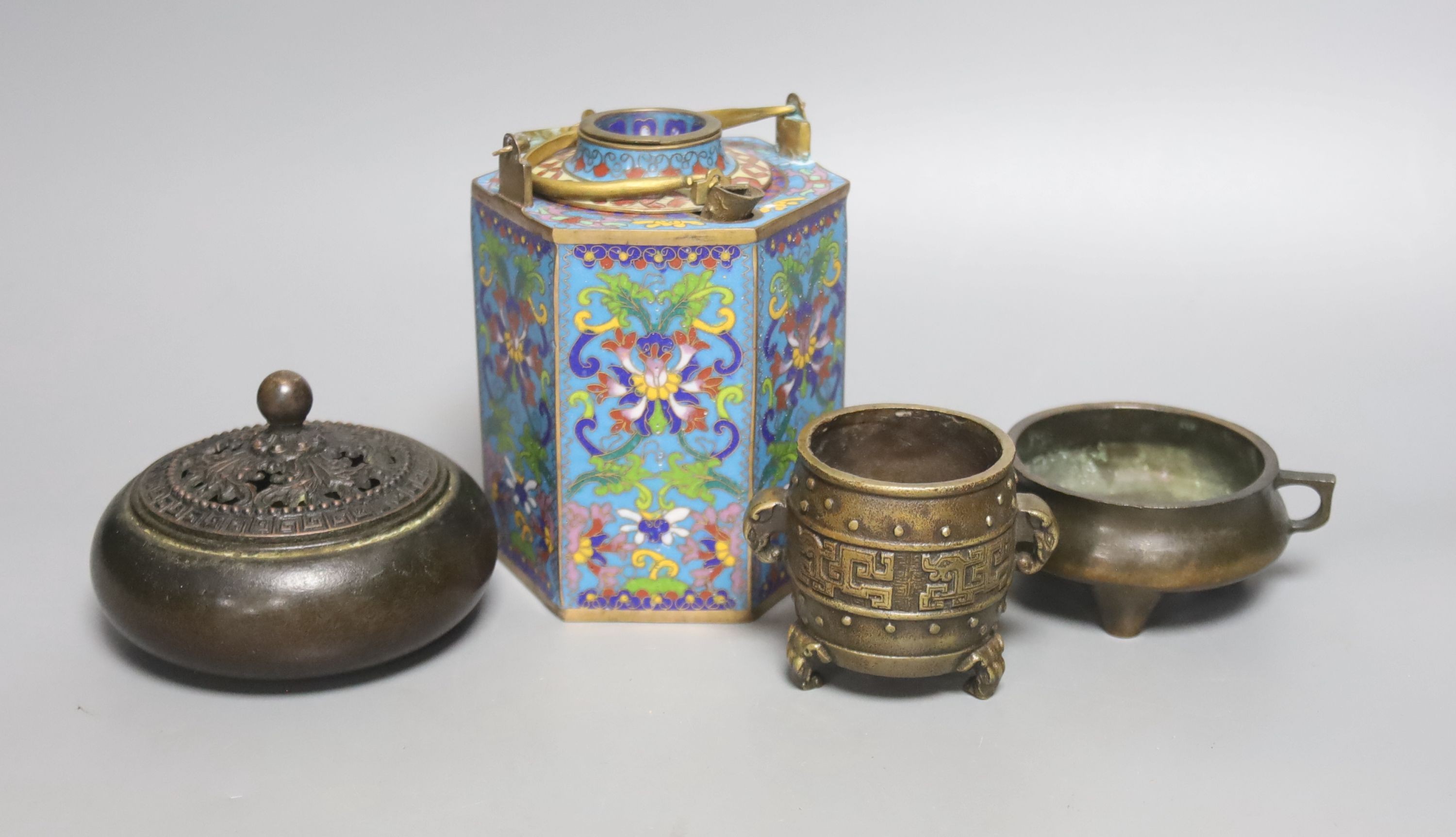 A Chinese small bronze tripod censer, a Chinese archaistic bronze tripod vessel, a bronze jar and