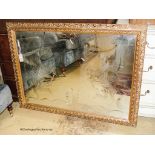 A rectangular gilt wall mirror etched with a stallion, width 120cm, height 90cm