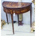 An early 19th century Dutch floral marquetry walnut D shaped folding card table, width 80cm, depth