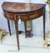 An early 19th century Dutch floral marquetry walnut D shaped folding card table, width 80cm, depth