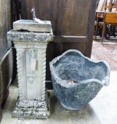 A copper sundial on reconstituted stone plinth, height 73cm together with a circular cast lead