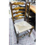 A set of four 18th century style ash rush seat ladderback dining chairs