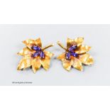A pair of 750 yellow metal and three stone amethyst set leaf brooches, 38mm, gross 11.2 grams.