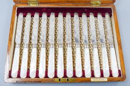 A cased set of twelve pairs of late Victorian mother of pearl handled silver dessert eaters, Z.