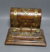 A 19th century domed brass mounted tea caddy, 23 x 18cm and a two bottled ink stand