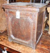 An 18th century oak cupboard of small proportions with rectangular hinged lid, width 43cm, depth