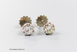 A pair of modern 18ct and solitaire diamond set ear studs, the stones each weighing approximately