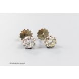 A pair of modern 18ct and solitaire diamond set ear studs, the stones each weighing approximately