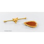 A 9ct and cabochon ruby set fox head bar brooch, 51mm, gross 4.5 grams and a yellow metal and