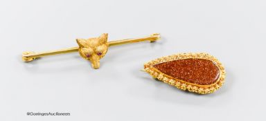 A 9ct and cabochon ruby set fox head bar brooch, 51mm, gross 4.5 grams and a yellow metal and