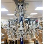 A gilt metal cut glass and lustre hung seven light chandelier84cm high