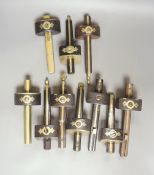 A collection of mahogany and ebony and brass marking gauges, longest 25cm