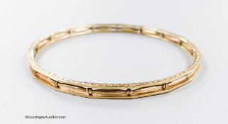 A pierced 9ct bangle, interior diameter 68mm, 13.2 grams.