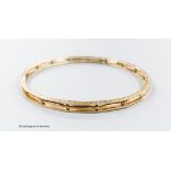 A pierced 9ct bangle, interior diameter 68mm, 13.2 grams.