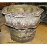 A large weathered Victorian octagonal carved stone font, width 80cm, height 67cm