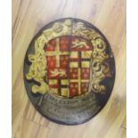 An oval painted wood armorial panel, for Admiral Thomas Exton, inscribed 1664 and possibly of the