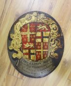 An oval painted wood armorial panel, for Admiral Thomas Exton, inscribed 1664 and possibly of the