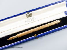 A 1960's engine turned 18k overlaid dip pen, with engraved inscription, 12.9cm, gross weight 24.4
