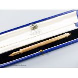 A 1960's engine turned 18k overlaid dip pen, with engraved inscription, 12.9cm, gross weight 24.4