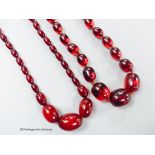 Two single strand graduated simulated cherry amber oval bead necklaces, longest 98cm, gross weight