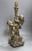 A gilt metal cherubic table lamp, signed, overall height 50cm