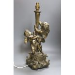 A gilt metal cherubic table lamp, signed, overall height 50cm