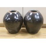 A pair of large monochrome brown glazed jars, height 40cm