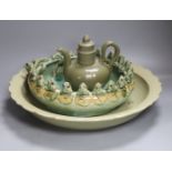A large Chinese celadon glazed dish, a Chinese green crackle glaze ewer and cover and a 'frog pond'