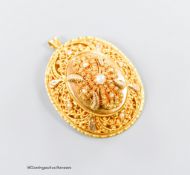 A pierced yellow metal and seed pearl set oval pendant brooch, 40mm, gross 17.9 grams.