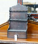 An 18th century oak spoon rack, of shaped outline with drawer below, width 29cm, depth 13cm, height