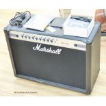 A Marshall MG 102 CF guitar amp with footswitch