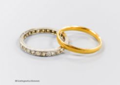 A 22ct gold wedding band, size M, 2.3 grams and a white metal and diamond set full eternity ring,