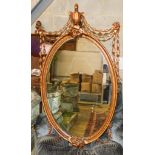 An oval Victorian style gilt wall mirror, width 70cm, height 120cm