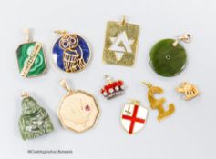 A small collection of ten assorted mainly yellow metal and gem set pendants including a red enamel