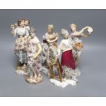 A pair of German musical figurines and three other similar figurines, tallest 23cm