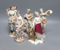 A pair of German musical figurines and three other similar figurines, tallest 23cm