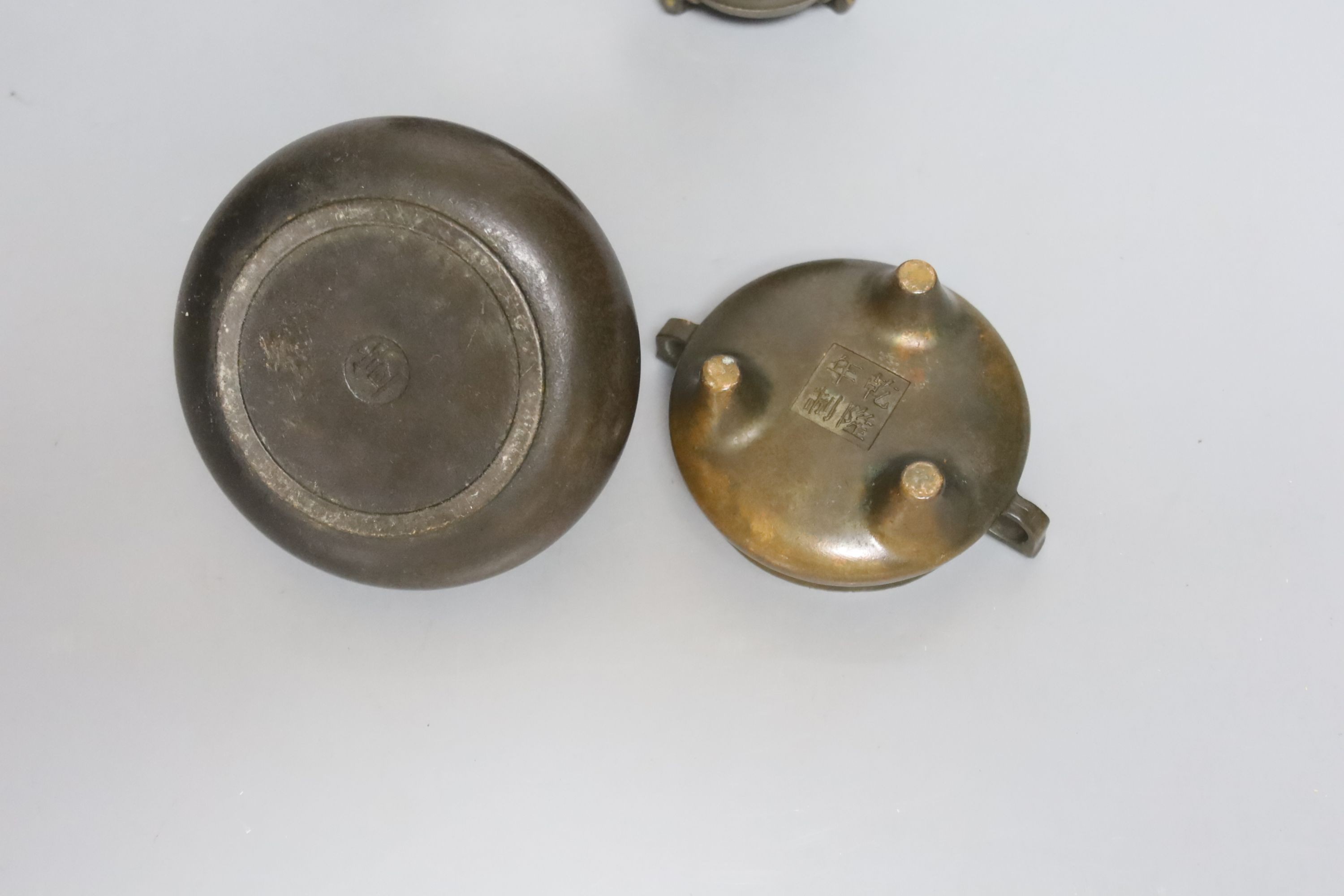A Chinese small bronze tripod censer, a Chinese archaistic bronze tripod vessel, a bronze jar and - Image 3 of 4