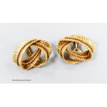 A pair of textured 750 yellow metal 'fern knot' ear clips, 27mm, 16.8 grams.