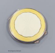 A George VI silver and yellow guilloche enamel circular compact, Birmingham, 1944, 65mm.