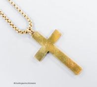 A hollow yellow metal cross pendant, 53mm, together with an Edwardian yellow metal choker chain,
